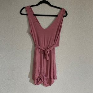 Pink romper that’s backless with a tie front.